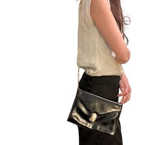 Black and Gold Crossbody Bag with Skull Clasp